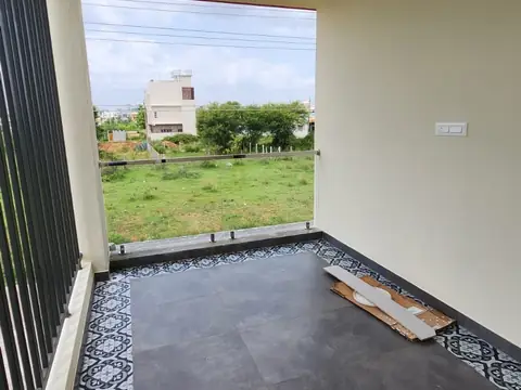 Balcony with patterned tiles and open view, Villa 1