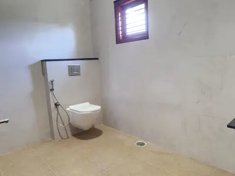 Attached bathroom with wall-hung toilet, Villa 1