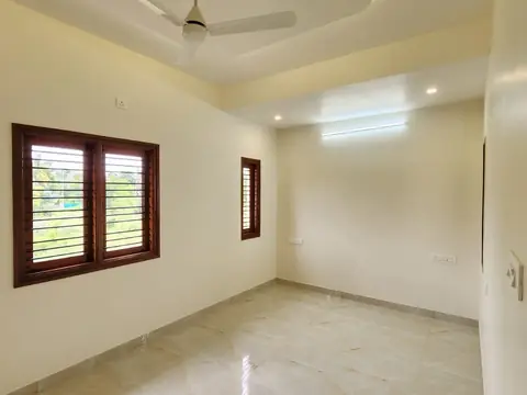 Bedroom with ceiling fan and window, Villa 1