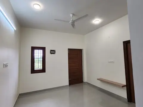 Bedroom with ceiling fan, window and wooden door, Villa 1