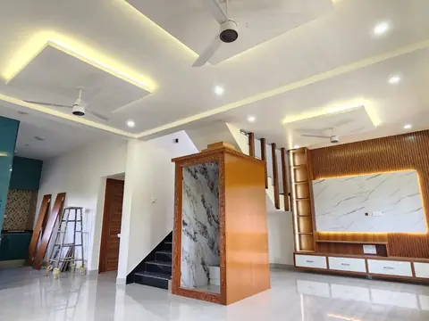 Living room with TV unit, false ceiling and staircase, Villa 1