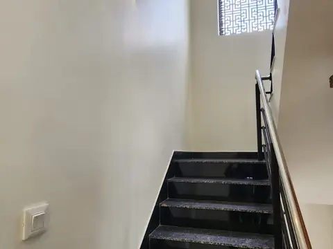Staircase with granite steps and handrail, Villa 1