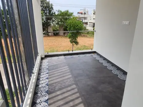 Balcony with patterned tile border and open view, Villa 2