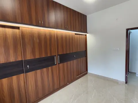 Sliding wardrobe and attached bathroom entrance, Villa 2