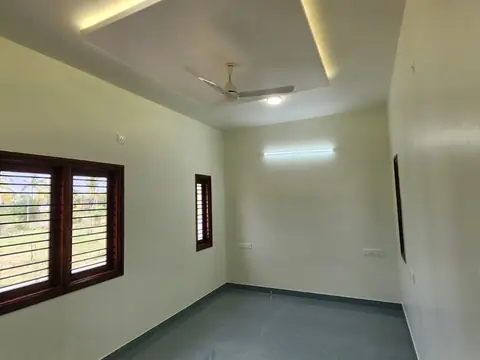 Bedroom with wooden-framed window, Villa 2