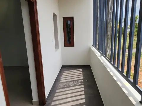 First-floor corridor with bar railing, Villa 2
