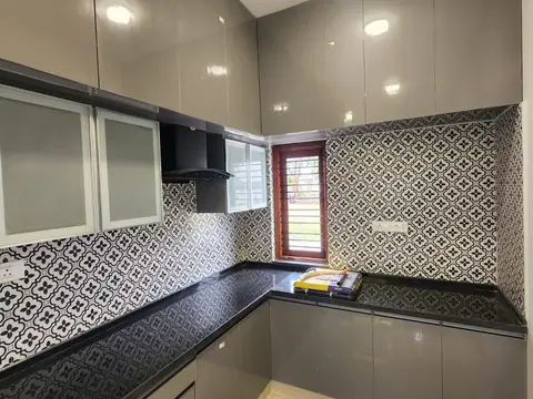 Kitchen corner with chimney, glass-front cabinets and patterned backsplash, Villa 2