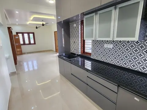 Fitted kitchen with grey cabinets and black-and-white patterned backsplash, Villa 2