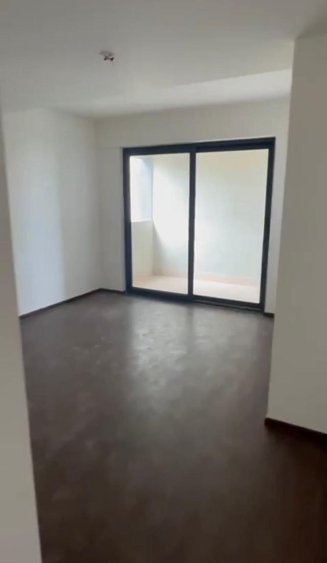 Bedroom with a sliding balcony door, 24th floor 3 BHK in Purva Atmosphere