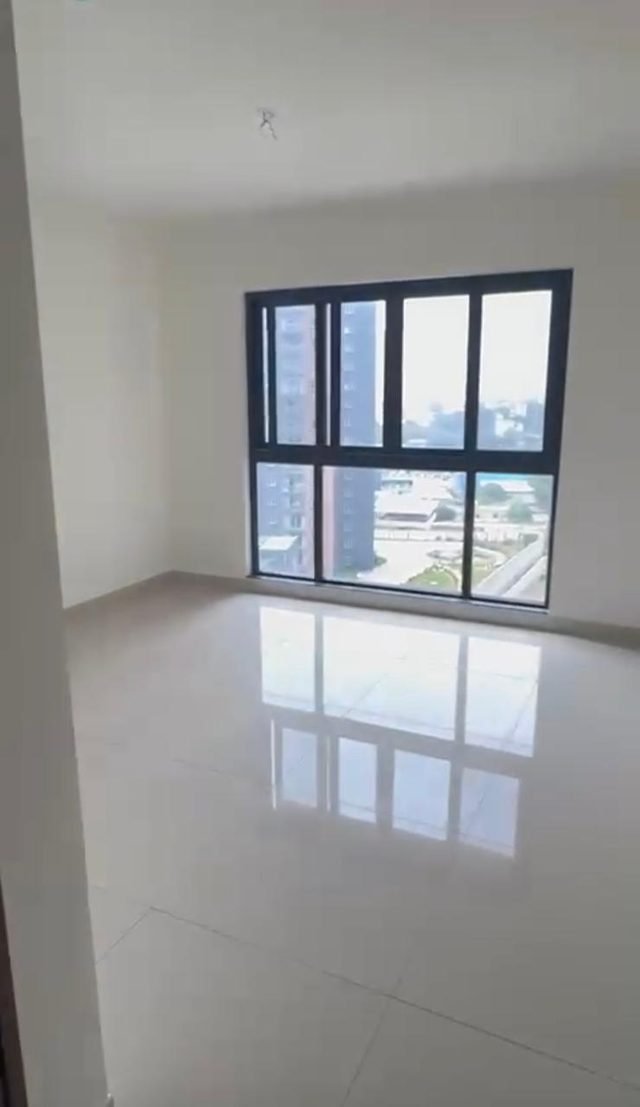 Bedroom with a large window and city view, 24th floor 3 BHK in Purva Atmosphere