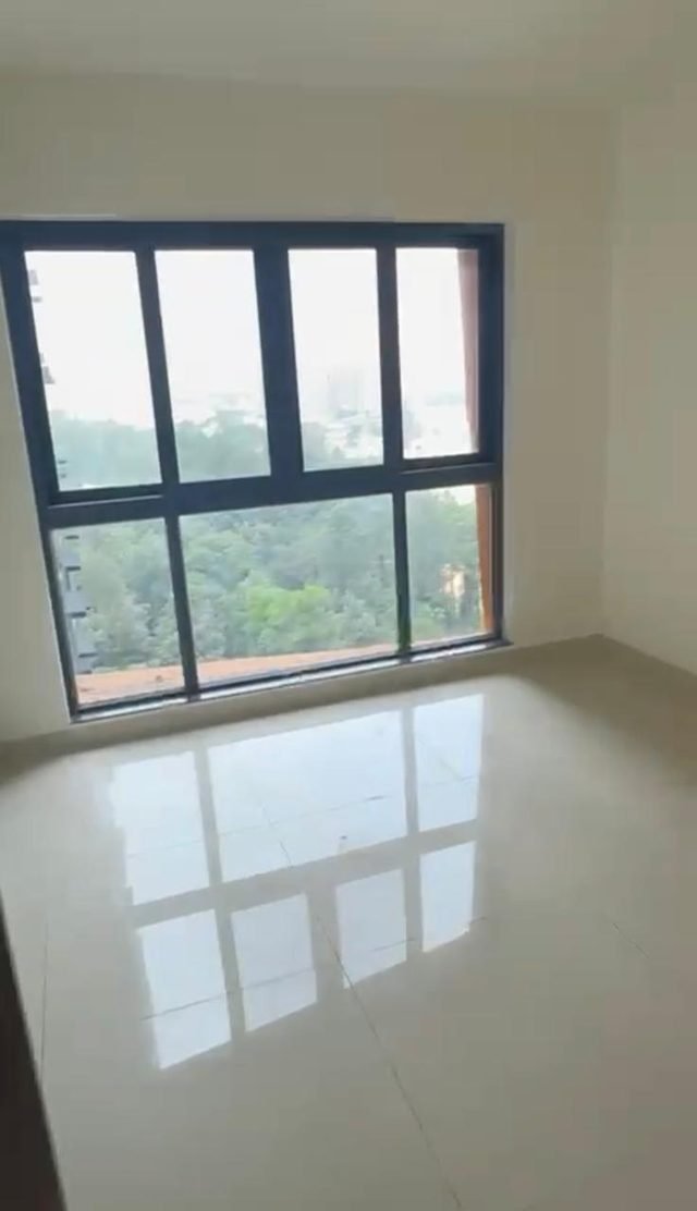 Bedroom window looking out over trees, 24th floor 3 BHK in Purva Atmosphere