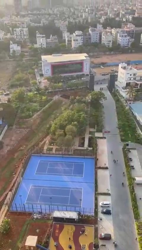 Tennis court and play area seen from the 24th floor of Purva Atmosphere
